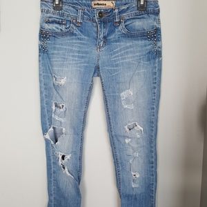 Ripped, studded denim jeans
